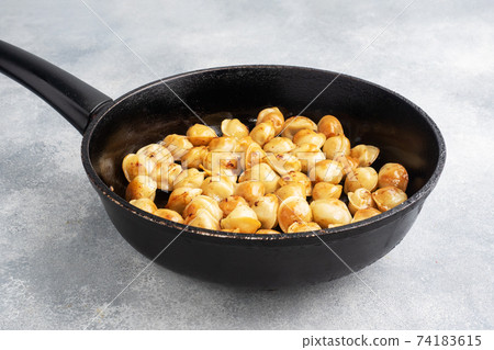 Delicious fried dumplings with meat in a pan. Delicious fried dumplings with meat in a pan. 74183615