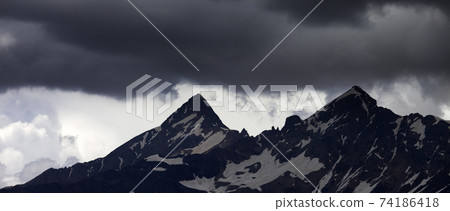 Panoramic view on storm clouds in high snowy mountains Panoramic view on storm clouds in high snowy mountains 74186418