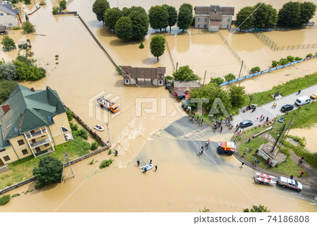 Aerial view of flooded houses and rescue vehicles saving people in Halych town, western Ukraine. Aerial view of flooded houses and rescue vehicles saving people in Halych town, western Ukraine. 74186808