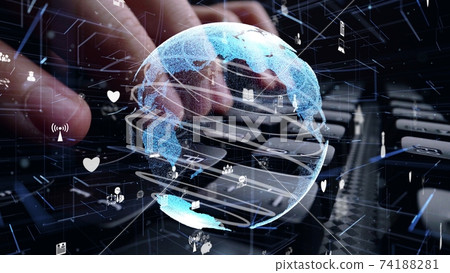 Man working on computer keyboard with graphic of internet networ 74188281