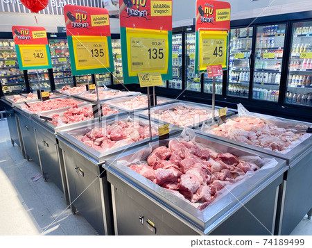Tesco Lotus,THAILAND- February 4, 2021 : variety of fresh meat/ Fresh fish and seafood are arranged in proportion and orderly on the loot, Fresh food products in famous department stores. 74189499