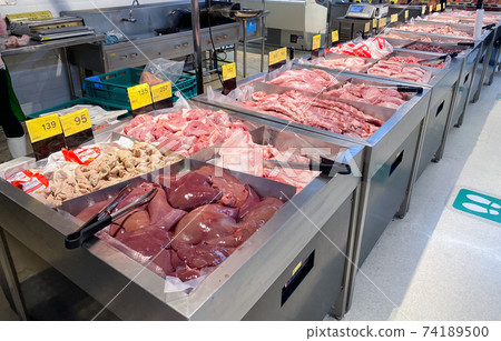 Tesco Lotus,THAILAND- February 4, 2021 : variety of fresh meat/ Fresh fish and seafood are arranged in proportion and orderly on the loot, Fresh food products in famous department stores. 74189500