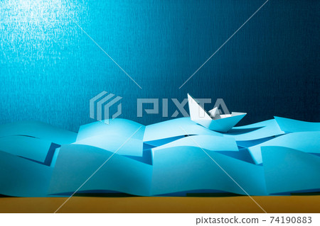 Paper ship in the paper sea. Concept of the theme of bureaucracy. Paper ship in the paper sea. Concept of the theme of bureaucracy. 74190883