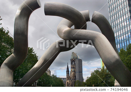 Berlin monument commemorating the city  unification with the Kaiser Wilhelm Memorial Church and anti-war memorial in the background. 74194046