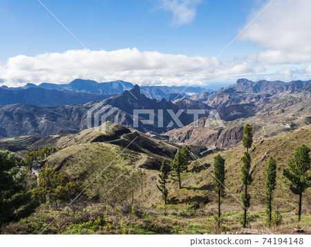 Amazing view on mountains, Caldera and Barranco de Tejeda and Roque Bentayg rock from Cruz de Tejeda Viewpoint. Gran Canaria, Canary Islands, Spain 74194148
