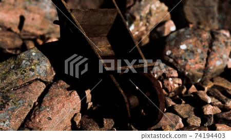 abandoned wooden mine wheelbarrow on rocks abandoned wooden mine wheelbarrow on rocks 74194403