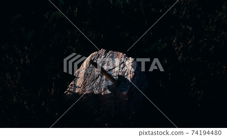 war ax for Viking on the rock at sunset war ax for Viking on the rock at sunset 74194480