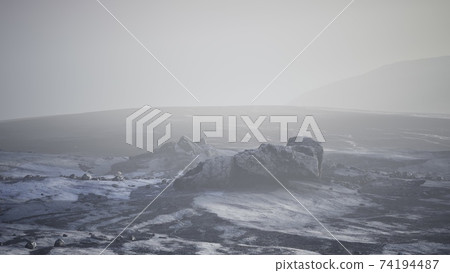 Antarctic mountains with snow in fog Antarctic mountains with snow in fog 74194487