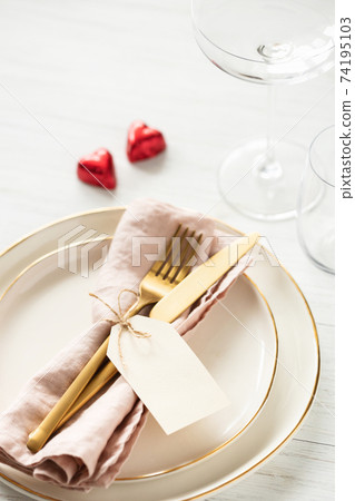 Romantic table setting with candy hearts. Romantic table setting with candy hearts. 74195103