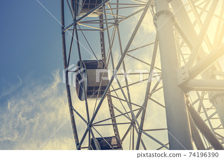 Gray or white metal ferris wheel with closed Gray or white metal ferris wheel with closed 74196390
