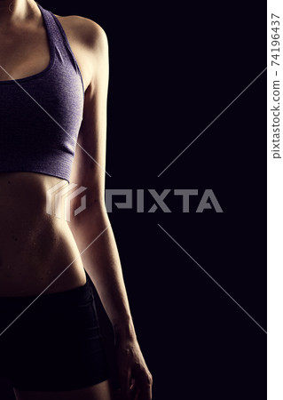 Slim beauty athletic woman on black background Slim beauty athletic woman on black background 74196437