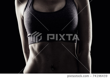 Slim beauty athletic woman on black background Slim beauty athletic woman on black background 74196439