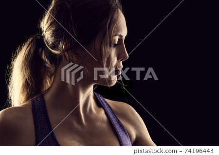 Slim beauty athletic woman on black background Slim beauty athletic woman on black background 74196443