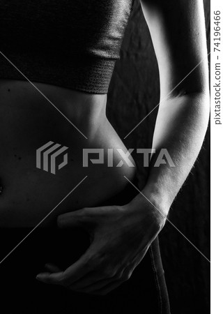 Slim beauty athletic woman on black background Slim beauty athletic woman on black background 74196466