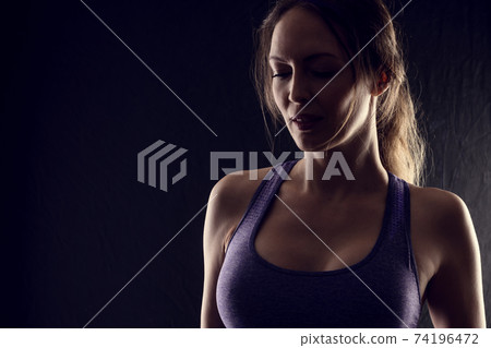Slim beauty athletic woman on black background Slim beauty athletic woman on black background 74196472