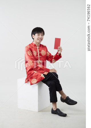 Young Asian man with red packet money 74196562