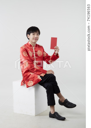 Young Asian man with red packet money Young Asian man with red packet money 74196563