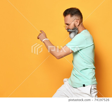 Handsome elder man dancing Handsome elder man dancing 74197526