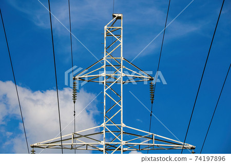 High voltage line against the blue sky. 74197896