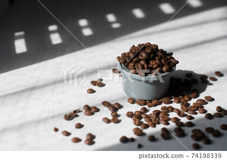 Coffee beans in a cup Coffee beans in a cup 74198339