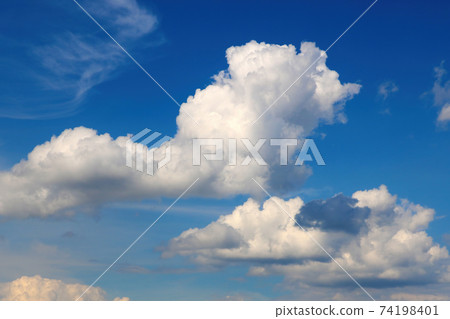 Beautiful white clouds against a dark sky before the storm. 74198401