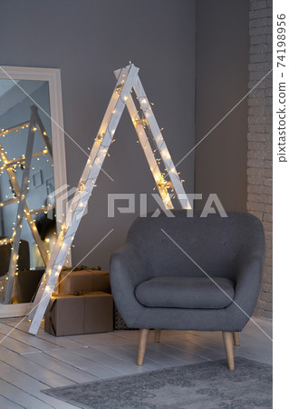 Details of a Scandinavian cozy interior in warm light beige. Details of a Scandinavian cozy interior in warm light beige. 74198956