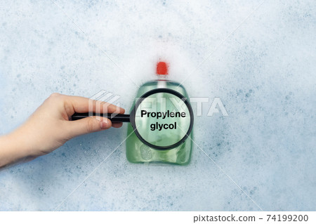 A bottle of Liquid soap floating in soapy water. Harmful ingredients, detergent with Propylene glycol. The concept of hazardous substances in cosmetics and household chemicals A bottle of Liquid soap floating in soapy water. Harmful ingredients, detergent with Propylene glycol. The concept of hazardous substances in cosmetics and household chemicals 74199200