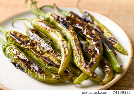 Grilled green chili pepper, ingredient of Northern Thai food 74199382