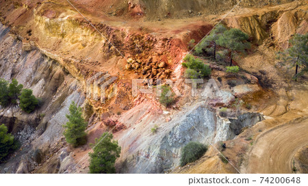 Aerial view on ore and sulfide deposits of Kokkinopezoula opencast mine near Mitsero, Cyprus 74200648