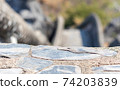 Concrete stone floor with a blurred background stairs down that is pathway down mountain. Sensitive focus. 74203839