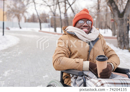 Disabled man with coffee Disabled man with coffee 74204135