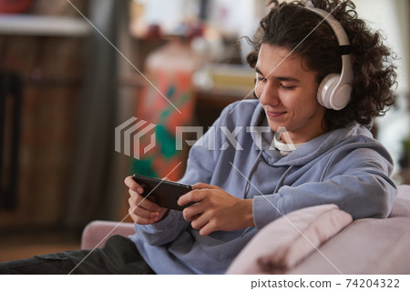 Teenage boy talking online 74204322