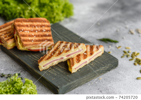 Delicious fresh toast grill with cheese and ham Delicious fresh toast grill with cheese and ham 74205720