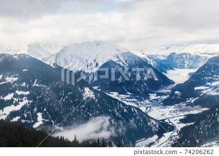 Winter view on the valley in Swiss Alps, Verbier, Switzerland Winter view on the valley in Swiss Alps, Verbier, Switzerland 74206262