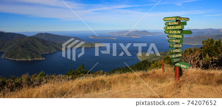 International directional signs and Queen Charlotte Sound, New Zealand. 74207652
