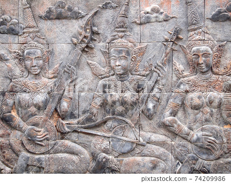 Native Thai culture stone carving on temple wall 74209986
