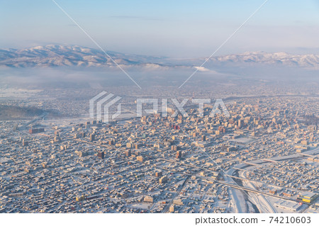 Asahikawa cityscape / winter view from the plane window / airplane Asahikawa cityscape / winter view from the plane window / airplane 74210603