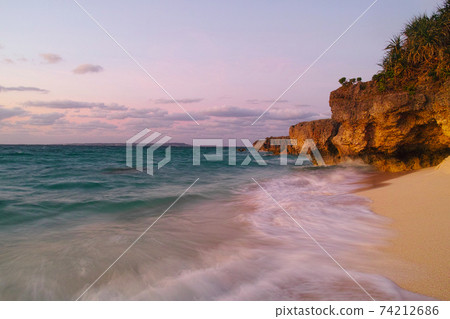 Miyakojima in midsummer. Dusk at Nagamahama Beach on Kurima Island Miyakojima in midsummer. Dusk at Nagamahama Beach on Kurima Island 74212686