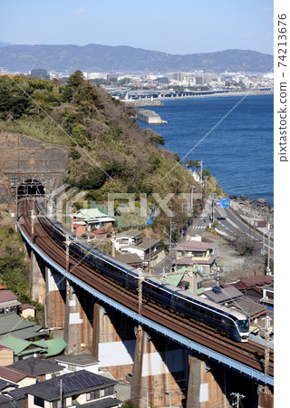 E261 series Safir Odoriko running in the background of Odawara city area E261 series Safir Odoriko running in the background of Odawara city area 74213676