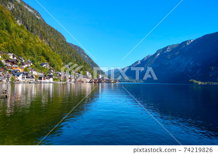 Nice view of the mountain village and lake in the mountains in Austria. selective focus. Nice view of the mountain village and lake in the mountains in Austria. selective focus. 74219826