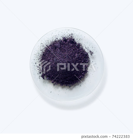 Close up inorganic chemical on white laboratory table. Potassium permanganate (KMnO4), a common chemical compound that combines manganese oxide ore with potassium hydroxide. 74222383