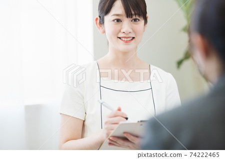 Female staff at an esthetic salon providing beauty counseling Female staff at an esthetic salon providing beauty counseling 74222465