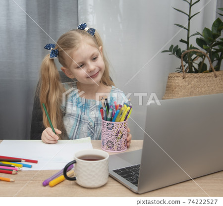 Cute girl doing homework Cute girl doing homework 74222527