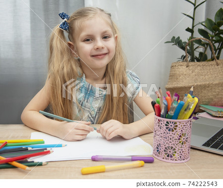 Cute girl doing homework Cute girl doing homework 74222543