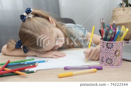 Cute girl doing homework 74222544
