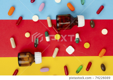 Disease and treatment. Medicine concept. Medication and packaging on bright background. Studio Photo 74226089
