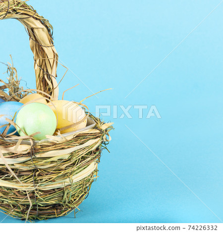Colorful background with Easter eggs on blue background. Happy Easter concept. Can be used as poster, background, holiday card. Flat lay, top view, copy space. Studio Photo Colorful background with Easter eggs on blue background. Happy Easter concept. Can be used as poster, background, holiday card. Flat lay, top view, copy space. Studio Photo 74226332