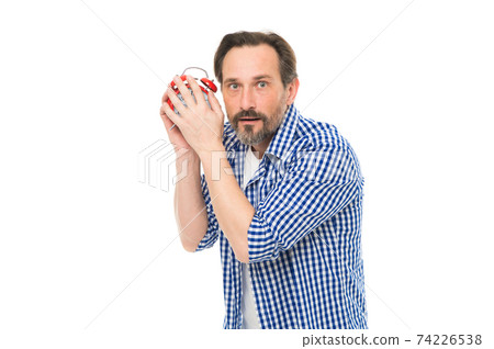 Im only young once. Mature man listening to clock ticking 74226538