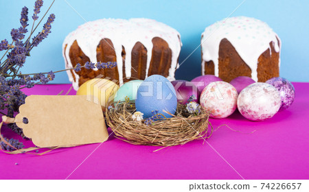 Colorful background with Easter eggs on pink and blue background. Happy Easter concept. Can be used as poster, background, holiday card. Flat lay, top view, copy space. Studio Photo Colorful background with Easter eggs on pink and blue background. Happy Easter concept. Can be used as poster, background, holiday card. Flat lay, top view, copy space. Studio Photo 74226657