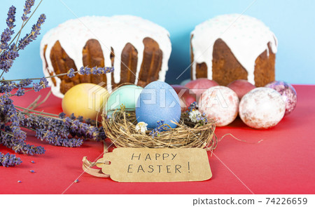 Colorful background with Easter eggs on red and blue background. Happy Easter concept. Can be used as poster, background, holiday card. Flat lay, top view, copy space. Studio Photo Colorful background with Easter eggs on red and blue background. Happy Easter concept. Can be used as poster, background, holiday card. Flat lay, top view, copy space. Studio Photo 74226659